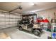 Spacious garage with golf cart, ample storage space, and work area at 4087 Capland Ave, Clermont, FL 34711