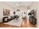 Spacious living room featuring high ceilings, hardwood floors, leather furniture and lots of light at 4087 Capland Ave, Clermont, FL 34711
