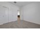 Spacious bedroom with double closet doors and soft carpet at 5036 Blanket Flower St, Apopka, FL 32712