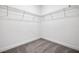 Walk-in closet with wire shelving, providing ample storage space in a new home at 5036 Blanket Flower St, Apopka, FL 32712