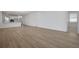 Spacious living room featuring wood-look flooring and a neutral color palette at 5036 Blanket Flower St, Apopka, FL 32712