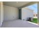 Covered outdoor patio featuring a concrete floor and view to the backyard and HVAC system at 5036 Blanket Flower St, Apopka, FL 32712
