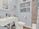 Bright bathroom features modern fixtures, a toilet, and a shower with tiled walls at 506 Richard St, Leesburg, FL 34748