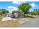 View of the carport that is large enough to cover vehicles and has a patio space attached at 506 Richard St, Leesburg, FL 34748