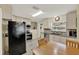 Bright kitchen with tile floors, stylish backsplash, stainless steel appliances, and ample cabinetry at 506 Richard St, Leesburg, FL 34748