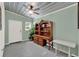 Versatile office space with built-in desk, shelving, and ample natural light at 506 Richard St, Leesburg, FL 34748