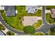 Aerial view of home with property lines, landscaping, and circular drive in a green neighborhood at 5075 China Sea Dr, Tavares, FL 32778