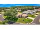 Aerial view of a well-kept property with mature landscaping, screened lanai, and circular drive in a green neighborhood at 5075 China Sea Dr, Tavares, FL 32778