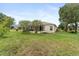 Spacious backyard with a screened lanai at 5075 China Sea Dr, Tavares, FL 32778