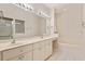 Bright bathroom featuring dual sinks, a bathtub, and a glass-enclosed shower at 5075 China Sea Dr, Tavares, FL 32778