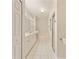 Bright bathroom with dual sinks, white cabinetry, and a separate tub and shower at 5075 China Sea Dr, Tavares, FL 32778