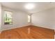 Bedroom featuring hardwood floors and windows at 5075 China Sea Dr, Tavares, FL 32778