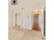 Bright bedroom with neutral carpeting, ceiling fan, and access to a closet and hallway at 5075 China Sea Dr, Tavares, FL 32778