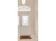 Front door with decorative glass panel, transom window, and welcome mat at 5075 China Sea Dr, Tavares, FL 32778