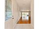 Light and bright foyer with hardwood floors flows into the home's main living area at 5075 China Sea Dr, Tavares, FL 32778