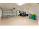 Spacious garage with ample storage space, accommodates vehicles and equipment with room for workbench at 5075 China Sea Dr, Tavares, FL 32778