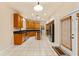 Eat-in kitchen with stainless steel appliances, granite countertops, tiled floor, and view to backyard at 5075 China Sea Dr, Tavares, FL 32778