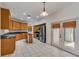Spacious kitchen with light-colored wood cabinets, stainless steel appliances, and a large island at 5075 China Sea Dr, Tavares, FL 32778