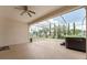 Spacious screened lanai, perfect for outdoor entertaining with serene views of the landscaped backyard at 5075 China Sea Dr, Tavares, FL 32778