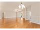 Open-plan living room with hardwood floors and natural light at 5075 China Sea Dr, Tavares, FL 32778