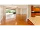 Spacious living room with hardwood floors, sliding glass doors to the lanai, and an open layout at 5075 China Sea Dr, Tavares, FL 32778