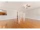 Spacious living room with hardwood floors and a ceiling fan at 5075 China Sea Dr, Tavares, FL 32778