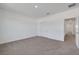 The bedroom has neutral carpet, white walls, closet and offers a bright space with access to other rooms at 5105 Blanket Flower St, Apopka, FL 32712