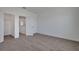 Neutral bedroom with carpet floors, closet, and an attached bathroom at 5105 Blanket Flower St, Apopka, FL 32712