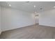 A spacious bedroom offers recessed lighting, neutral carpet, and white walls, creating a bright and airy atmosphere at 5105 Blanket Flower St, Apopka, FL 32712
