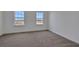 Bedroom featuring carpet floors, two large windows offering natural light at 5105 Blanket Flower St, Apopka, FL 32712