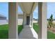Inviting covered front porch with support columns and a dark front door at 5105 Blanket Flower St, Apopka, FL 32712