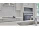 Close-up of the kitchen featuring stainless steel range hood and backsplash at 5105 Blanket Flower St, Apopka, FL 32712