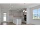 Bright open concept kitchen with recessed lighting, a large island and stainless appliances at 5105 Blanket Flower St, Apopka, FL 32712