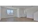 Bright living room featuring wood-look tile floors, recessed lighting, and a large window at 5105 Blanket Flower St, Apopka, FL 32712