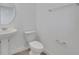 Clean and simple powder room with a pedestal sink and a standard toilet at 5105 Blanket Flower St, Apopka, FL 32712