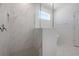 Modern bathroom showcasing marble look tile and a walk-in shower at 5125 Waypointe Blvd, Apopka, FL 32712