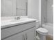 Clean, white bathroom featuring modern fixtures and a tiled shower-tub combo at 5125 Waypointe Blvd, Apopka, FL 32712
