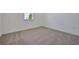 Cozy bedroom with neutral carpet, white walls, and natural light from the window at 5125 Waypointe Blvd, Apopka, FL 32712