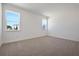 Bright bedroom with carpet flooring, natural light, and neutral color palette at 5125 Waypointe Blvd, Apopka, FL 32712
