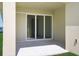 Covered patio area with sliding glass doors offers easy access to the home's interior at 5125 Waypointe Blvd, Apopka, FL 32712