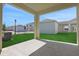 Covered patio area offers a relaxing outdoor space with views of the green lawn at 5125 Waypointe Blvd, Apopka, FL 32712