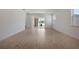 Modern living room features tile flooring and sliding doors leading to outdoor at 5125 Waypointe Blvd, Apopka, FL 32712