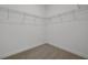 Spacious walk-in closet features wire shelving and neutral carpet, offering ample storage at 5125 Waypointe Blvd, Apopka, FL 32712