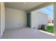 Covered back patio with a neutral color, providing an outdoor space for relaxation at 5129 Blanket Flower St, Apopka, FL 32712