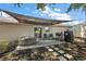Backyard patio with a hot tub, grill, and a paved walkway, perfect for outdoor entertaining at 529 Ed Douglas Rd, Groveland, FL 34736