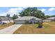 Charming single-Gathering home with a two-car garage and well-maintained landscaping at 529 Ed Douglas Rd, Groveland, FL 34736