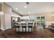 Spacious open kitchen featuring stainless steel appliances, an island, and wood-look floors at 529 Ed Douglas Rd, Groveland, FL 34736