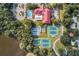 Aerial view of the community center with pool, tennis courts, shuffleboard courts and parking areas at 5500 Laver St, Leesburg, FL 34748