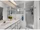 Bright bathroom with dual sinks, shower, and a clean, functional layout at 5500 Laver St, Leesburg, FL 34748