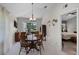 Cozy dining room with wood table set and french doors leading to the outside space at 5500 Laver St, Leesburg, FL 34748